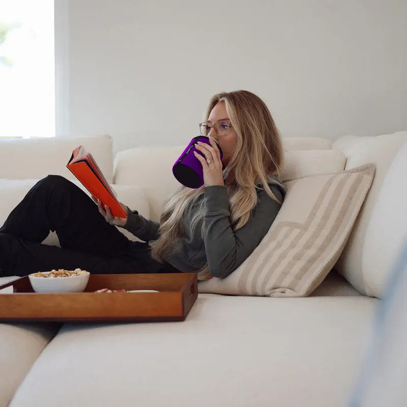 Woman reading on couch with purple Wrapsulator Regular 