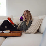 Woman reading on couch with purple Wrapsulator Regular 