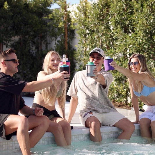Group of four friends sitting around a jacuzzi, enjoying their iCube Wrapsulators